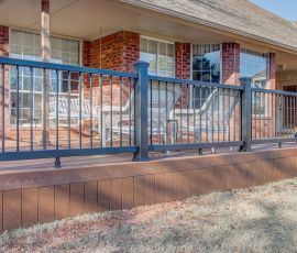 A stylish outdoor deck featuring a sturdy black metal railing and wooden flooring, ideal for outdoor gatherings and enjoying the backyard space. Backyard deck with black metal railing and wooden flooring, perfect for outdoor relaxation and enter.