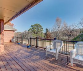 Spacious outdoor deck featuring comfortable seating and a beautiful view, ideal for outdoor gatherings and enjoying nature. Outdoor deck with seating area and scenic view, perfect for relaxing and entertaining. Built by Deck.