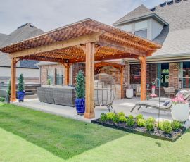 Elegant backyard pergola with comfortable seating, perfect for outdoor gatherings and relaxation. Outdoor pergola with seating and lounge area for backyard relaxation.