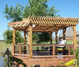 Beautiful wooden deck with pergola by the water, perfect for outdoor gatherings and enjoying nature. Wooden deck with pergola for outdoor relaxation and entertainment.
